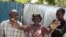 A woman expresses her happiness following the release of American nurse Alix Dorsainvil and her young daughter, outside the El Roi Haiti school academy in Cite Soleil community of Port-au-Prince, Haiti, Aug. 9, 2023. 