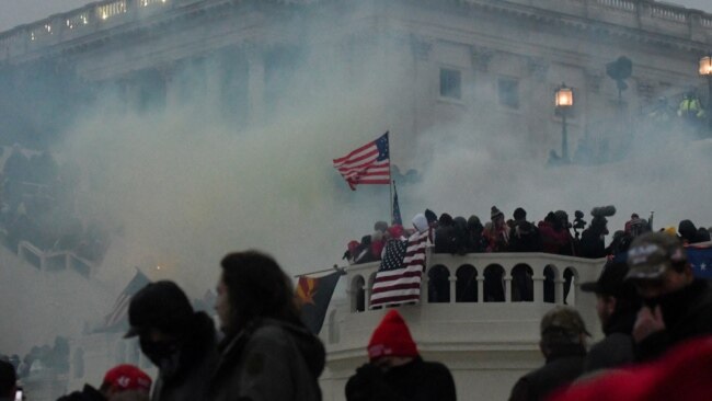 FILE - More than 500 have pleaded guilty to federal charges, while dozens have been convicted at trial in connection to the Jan. 6, 2021, assault on the U.S. Capitol in Washington. The FBI says it is seeking information about more than 260 others suspected of committing violence.