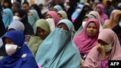 FILE - Relatives of victims take part in an event to commemorate the 19th anniversary of the 2004 'Tak Bai Massacre,' when scores of arrested protesters suffocated to death in army trucks, in Tak Bai, in Thailand's Narathiwat province, Oct. 25, 2023.