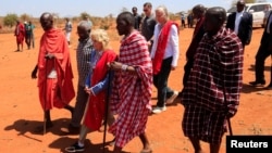 US first lady Jill Biden walks with traditional Maasai elders at the drought response site during a visit to highlight the impacts of drought relief at the Lositeti village in Matapato North, Kajiado County, Kenya, Feb. 26, 2023.