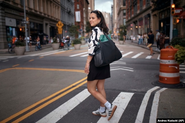 Entrepreneur, Becky Litvintchouk, heads home after work, on Aug. 12, 2024, in New York. (AP Photo/Andres Kudacki)