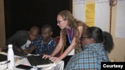 Journalist and InfoNile co-founder Annika McGinnis (standing) is pictured with Fredrick Mugira (second-left) during a Nile Basin training session. (Credit: InfoNile)