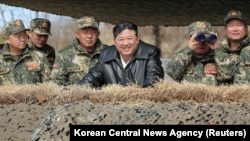 North Korean leader Kim Jong Un guides an artillery firing drill by the Korean People's Army, the country's military force, in North Korea on March 7, 2024, in this photo released March 8, 2024, by the Korean Central News Agency, according to the KCNA. (KCNA via Reuters)