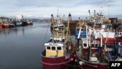 FILE - Trawlers are seen in the harbor in Brixham, southern England, on Oct.11, 2018.