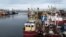 FILE - Trawlers are seen in the harbor in Brixham, southern England, on Oct.11, 2018.