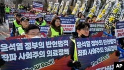 Members of the Gyeonggi Province Medical Association stage a rally against the government's medical policy near the presidential office in Seoul, South Korea, March 13, 2024. 