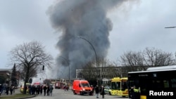 Heavy smoke rises during a major fire in Hamburg-Rothenburgsort, Germany, April 9, 2023.