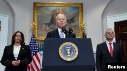 Presidenti Biden i shoqëruar nga nënpresidentja Harris dhe prokurori i përgjithshëm Garland (14 korrik 2024)