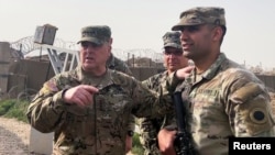 U.S. Joint Chiefs Chair Army General Mark Milley speaks with U.S. forces in Syria during an unannounced visit, at a U.S. military base in northeast Syria, March 4, 2023.