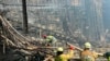 Crews work inside the Crocus City Hall on the western edge of Moscow, March 23, 2024, following an attack Friday, for which the Islamic State group claimed responsibility. (Russian Emergency Ministry Press Service via AP) 