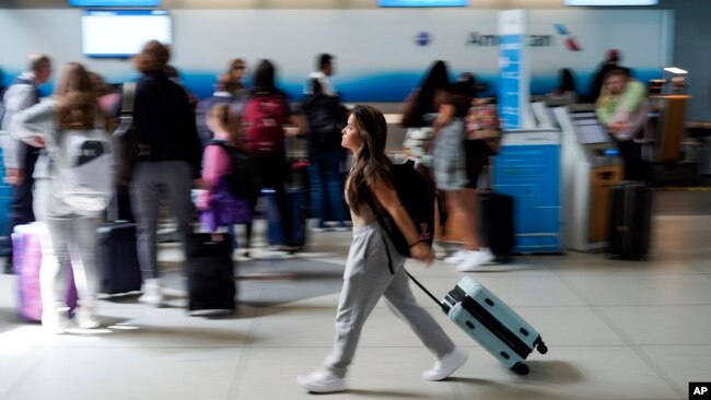 A person walks by the ticketing lobby at the Charlotte Douglas International Airport on May 25, 2023, in Charlotte, a city in the U.S. state of North Carolina.
