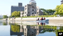 Police officers patrol the river near the Atomic Bomb Dome as Japan's police beef up security ahead of the Group of Seven nations' meetings in Hiroshima, Japan, May 17, 2023. 