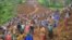 People are seen gathered at the site of a landslide in Gofa Zone, southern Ethiopia, July 22, 2024. (Isayas Churga/Gofa Zone Government Communication Affairs Department via AP)