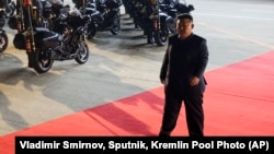 FILE - North Korea's leader Kim Jong Un walks to meet Russian President Vladimir Putin at Pyongyang Sunan International Airport outside Pyongyang, June 19, 2024. 