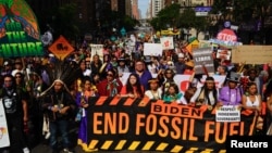 Activists mark the start of Climate Week in New York during a demonstration calling for the U.S. government to take action on climate change and reject the use of fossil fuels in New York City, Sept. 17, 2023. 