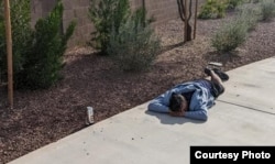 A resident of a fraudulent sober living home in Phoenix, Arizona, passed out on a residential sidewalk.