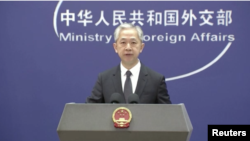 In this image taken from video, Wang Wenbin, a spokesperson for the Chinese Ministry of Foreign Affairs, speaks about the Israel-Hamas conflict at a press conference in Beijing on Oct. 11, 2023. (CCTV via Reuters)