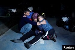 People react after an earthquake in Antakya in Hatay province, Turkey, Feb. 20, 2023.