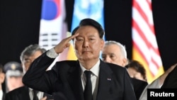 FILE - South Korean President Yoon Seok-yeol pays tribute at the Seoul Air Force Base in Seongnam, South Korea, July 26, 2023.