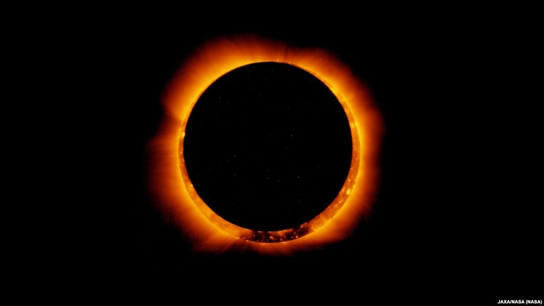 FILE - Photo of an annular solar eclipse taken by the solar optical telescope Hinode as the moon came between it and the sun. (JAXA/NASA)