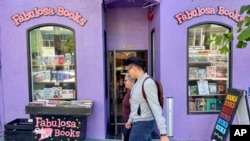 Pedestrians walk past the Fabulosa Books store in San Francisco's Castro District on June 27, 2024. 