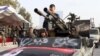 Libyan security forces take part in a military parade in the northwestern city of Misrata to commemorate the 13th anniversary of the uprising that toppled longtime strongman Muammar Kadhafi. February 28, 2024.