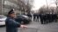 Armenian law enforcement officers stand outside a police station after an incident that the Caucasian country's government said was an attempt to seize the building in Yerevan, March 24, 2024. 