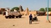 FILE - U.N. forces patrol the streets of Timbuktu, Mali, on Sept. 26, 2021. The United Nations is in the midst of a six-month exit from Mali on orders of the West African nation’s military junta. Residents of northern Mali now say they are effectively stuck in a war zone.