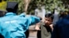 FILE - Chinese national Jack Wang, a security trainer at the Chinese-run DeWe Security Service, leads Kenyan security guards in martial arts combat training at their company compound in Nairobi, March 13, 2017. 