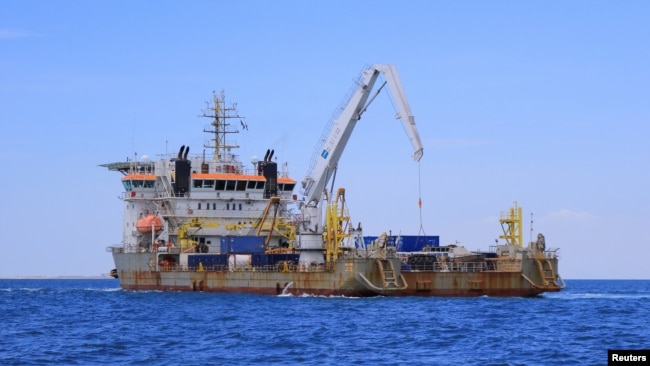 A vessel in charge of unloading oil from the decaying vessel FSO Safer is pictured off the coast of Ras Issa, Yemen, prior to the start of the unloading operation led by the United Nations to avoid an oil spill in the Red Sea, May 30, 2023.