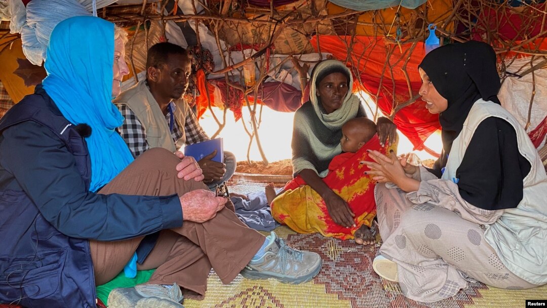 FILE - Cindy McCain, left, executive director of the U.N. World Food Program, meets an internally displaced Somali family at the Ladan camp for IDPs in Dollow, Somalia, May 1, 2023.