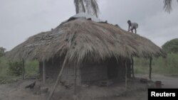 FILE - A teenager works on the roof of his house as Storm Freddy is due to hit Mozambique again, in the Nicoadala district, near Quelimane, Mozambique, March 10, 2023. (UNICEF Mozambique/2023/Alfredo Zuniga/Handout via Reuters)