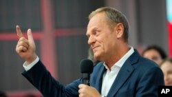 Donald Tusk, a former Polish prime minister addresses supporters at his party headquarters in Warsaw, Poland, Oct. 15, 2023. 