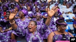 A women chants during the International Women's Day celebration at the Mobolaji Johnson Stadium in Lagos, Nigeria, March. 8, 2023.