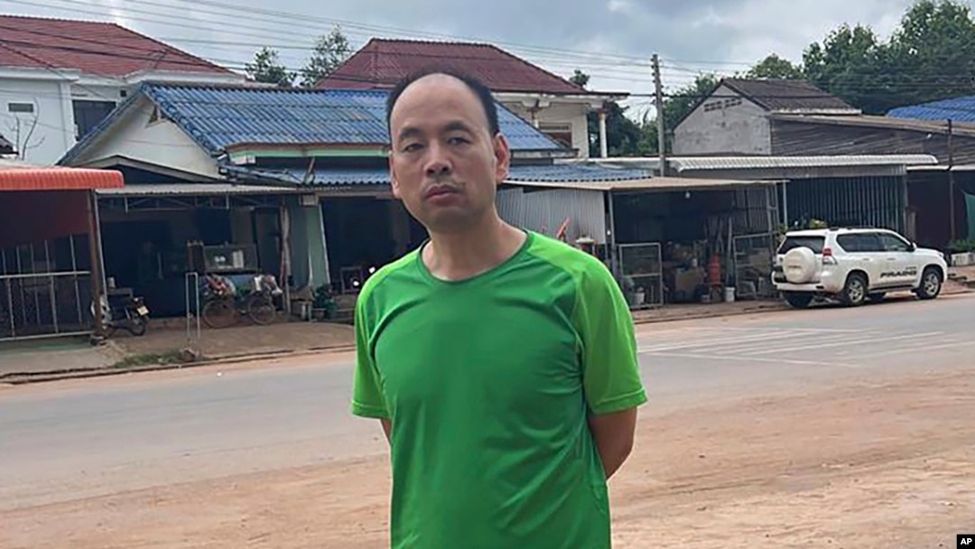 FILE - This photo from a source wishing to remain anonymous shows Chinese rights lawyer Lu Siwei on a road, at an undisclosed location, around 300 kilometers north of Vientiane, Laos, on July 27, 2023, as he headed south to the border with Thailand.