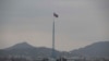 FILE - A North Korean flag flutters in North Korea's village Gijungdong in this photo taken from a South Korean observation post inside the demilitarized zone in Paju, South Korea, March 3, 2023. 