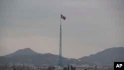 FILE - A North Korean flag flutters in North Korea's village Gijungdong in this photo taken from a South Korean observation post inside the demilitarized zone in Paju, South Korea, March 3, 2023. 