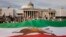 Demonstrators display a giant pre-revolution Iran flag as they gather in Trafalgar Square in London on Sept. 16, 2023, marking the anniversary of the death of Mahsa Amini in Iran.