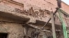 Bullet holes riddle the wall of a building at the Souk Sitta (Market Six) in the south of Khartoum on June 1, 2023. 