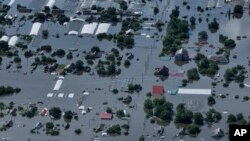 Houses are seen underwater in the flooded village of Dnipryany, in Russian-occupied Ukraine, Wednesday, June 7, 2023, after the collapse of Kakhovka Dam. (AP Photo)