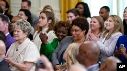 Shalanda Young, center right, director of the Office of Management and Budget, sits with White House press secretary Karine Jean-Pierre during an event to honor the LSU women's basketball team at the White House, May 26, 2023, in Washington.