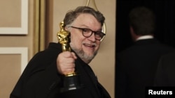 Guillermo del Toro celebrates with the Oscar for Best Animated Feature Film for "Guillermo del Toro's Pinocchio" in the Oscars photo room at the 95th Academy Awards in Hollywood, Los Angeles, California, U.S., March 12, 2023.