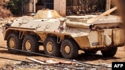 A Sudanese armed forces' (SAF) armored personnel carrier (APC) is pictured in southern Khartoum amidst ongoing fighting on June 7, 2023. 