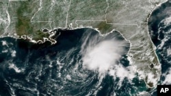 FILE - This GOES-East GeoColor satellite image taken June 2, 2023 and provided by NOAA, shows Tropical Storm Arlene, the first named storm of the Atlantic hurricane season, in the Gulf of Mexico. The second storm, Bret, is forming in the central Atlantic on June 19, 2023