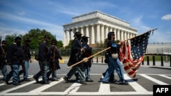 U.S. Civil War Colored Troops reenactors march near the Lincoln Memorial during "The Juneteenth People's Parade" in Washington, June 19, 2024.