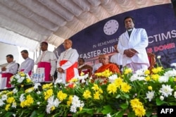 The Vatican ambassador to Colombo, Archbishop Brian Udaigwe (3L) and Sri Lanka's Cardinal Malcolm Ranjith (4L) take part in a remembrance service during the fifth anniversary of the Easter Sunday suicide attacks, in Colombo, Apr. 21, 2024.