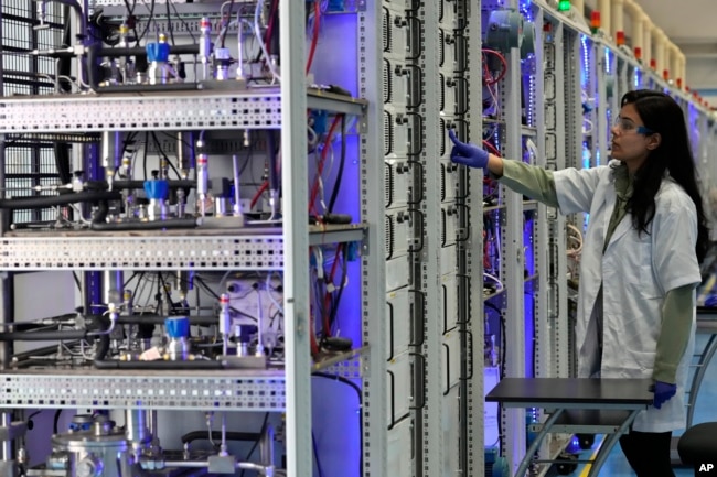 An engineer works in the research and development area at the Ohmium manufacturing facility in Chikkaballapur, outside Bengaluru, India, Tuesday, April 25, 2023. (AP Photo/Aijaz Rahi)