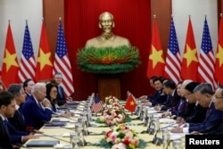 US President Joe Biden attends a meeting with Vietnam's Communist Party General Secretary Nguyen Phu Trong, at the Communist Party of Vietnam Headquarters in Hanoi, Sept. 10, 2023.