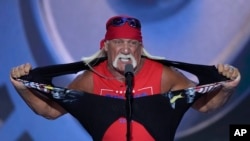 FILE - Hulk Hogan tears off his shirt while speaking on the final night of the Republican National Convention, July 18, 2024, in Milwaukee.