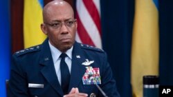 FILE - Chairman of the Joint Chiefs of Staff Air Force General CQ Brown participates in a virtual meeting at the Pentagon in Washington, Nov. 22, 2023. The top U.S. general began an unannounced visit to the Middle East on Saturday.